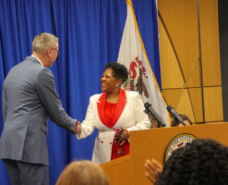 Honoree accepting award at Illinois State Treasurer's Women's History Month event