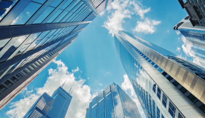 city buildings and the sky and clouds, as viewed from below