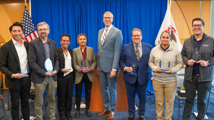 Treasurer Michael Frerichs poses with the recipients of LGBTQ+ awards in 2025