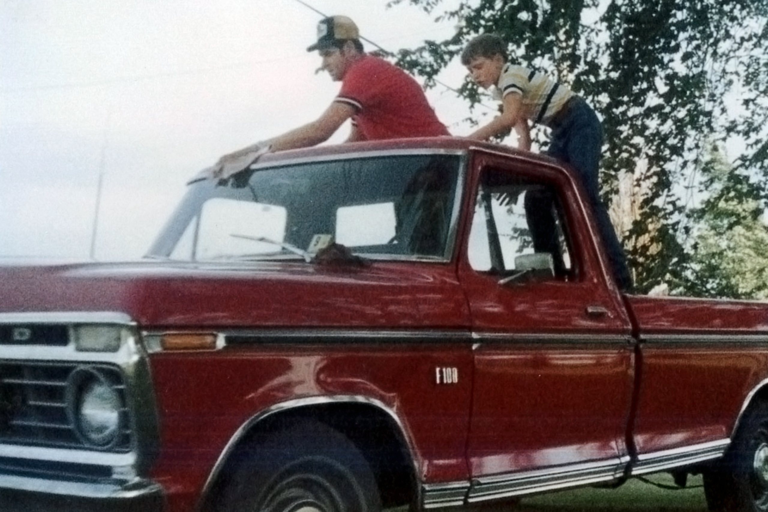 Childhood photo of Treasurer Frerichs with his father on a pick-up truck