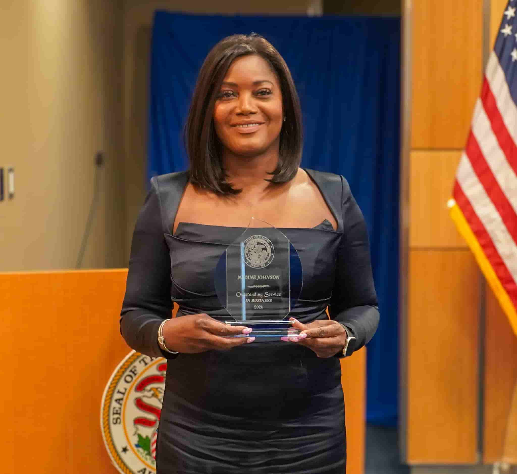 Christy George with her award at Treasurer Frerichs' Black History Month celebration