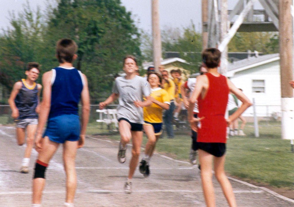 A young Treasurer Frerichs, around age 12, running a race outside with other boys