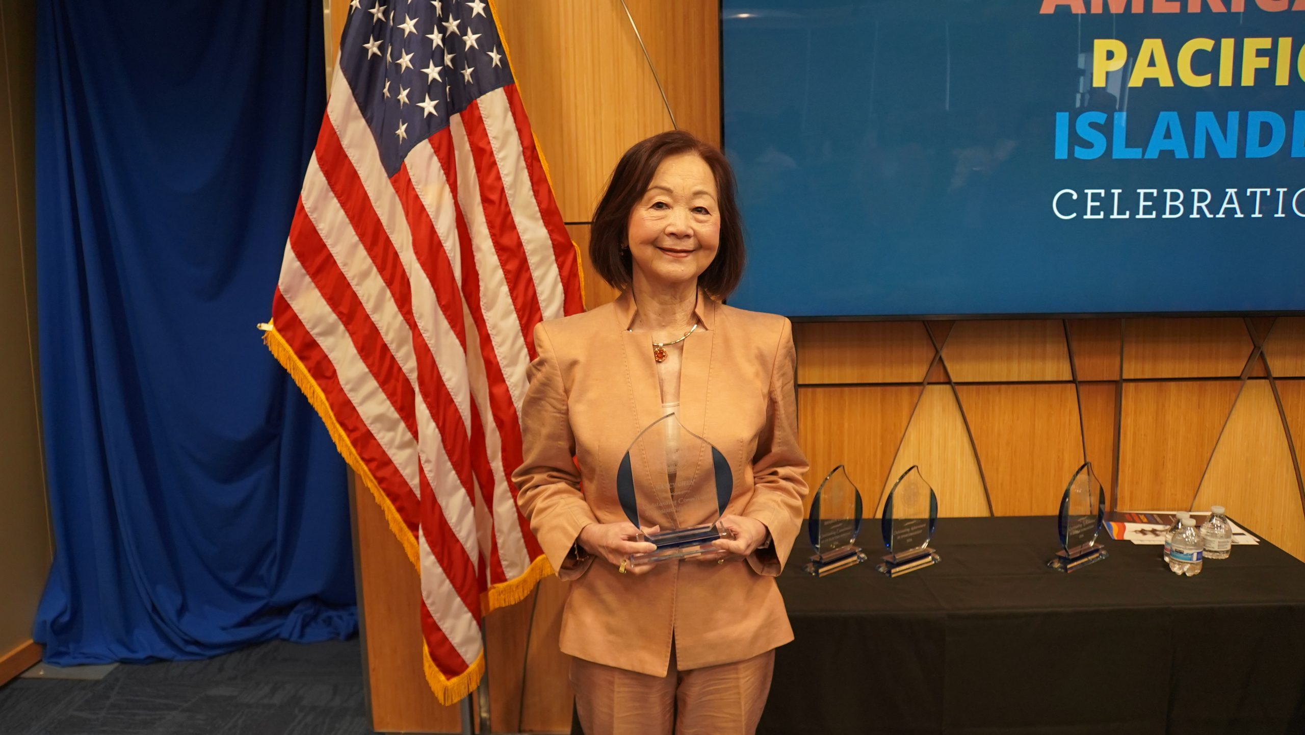 Christy George with her award at Treasurer Frerichs' Black History Month celebration