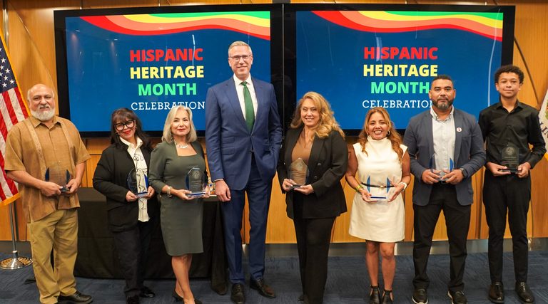 Treasurer Frerichs poses with the seven men and women who received Hispanic Heritage Month celebration awards